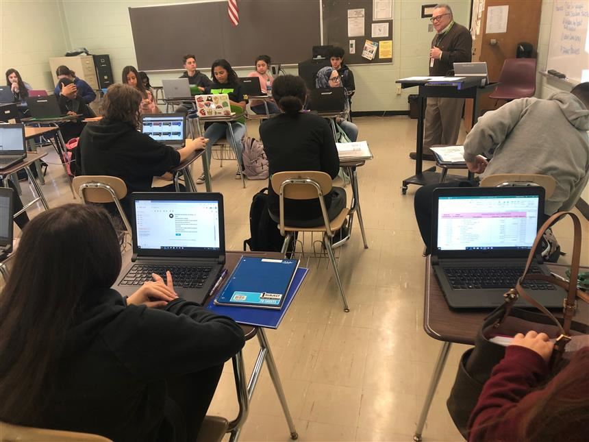 Mr. Ottino teaching Financial Literacy; photo credit: Rae Allex 